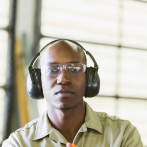 Man wearing safety goggles and ear muffs