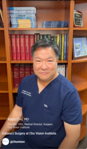Dr. Chu sitting in front of a bookshelf